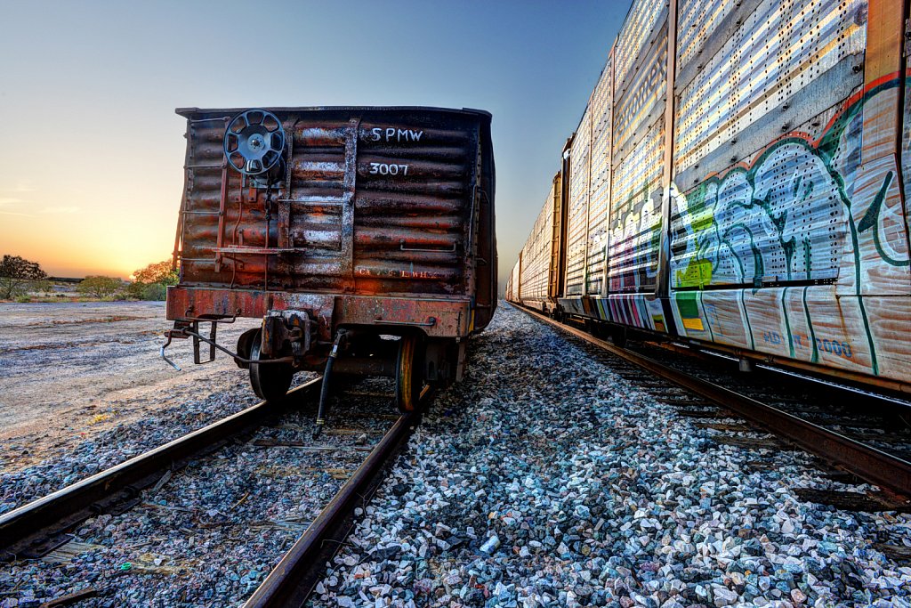 Grafitti at Sunset on Railcars